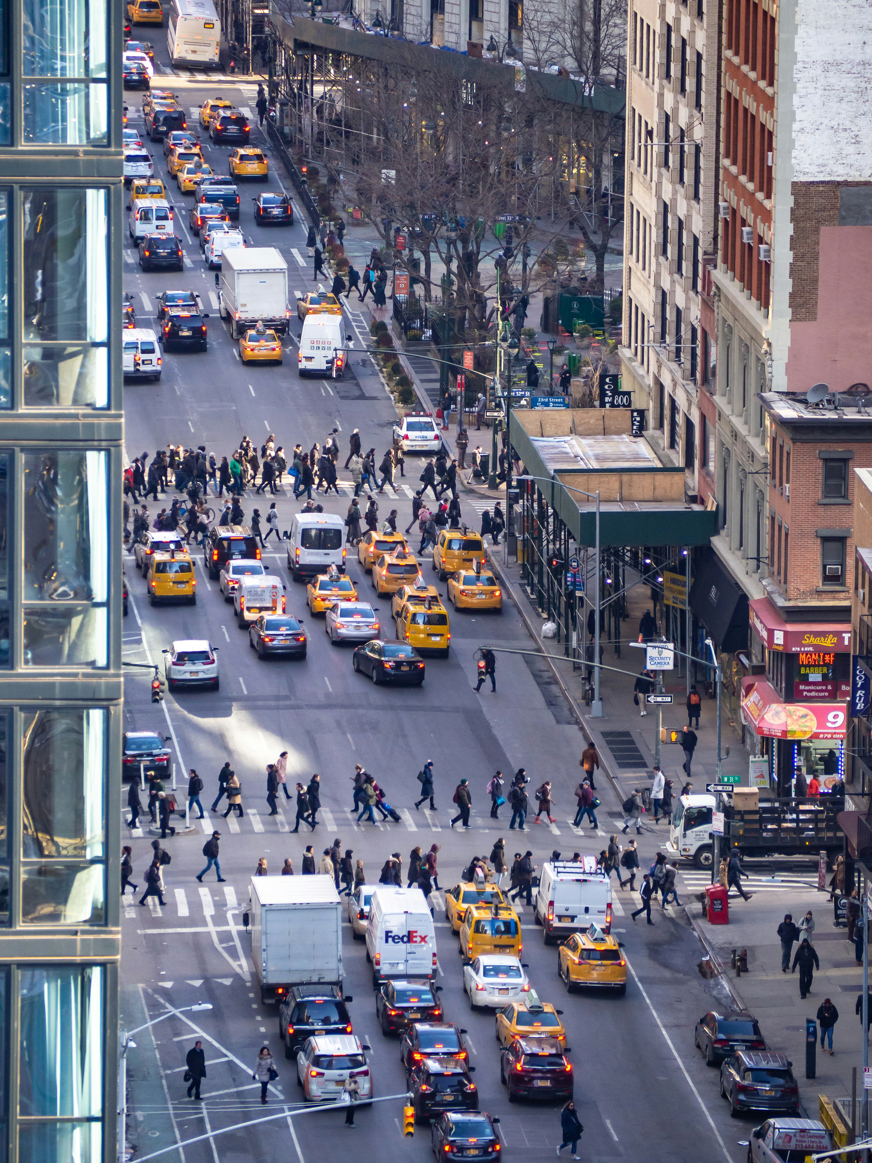 people and cars on road